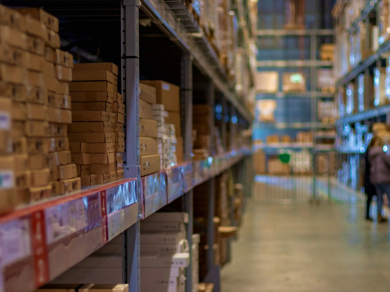 Modern warehouse with goods on folding metal shelves