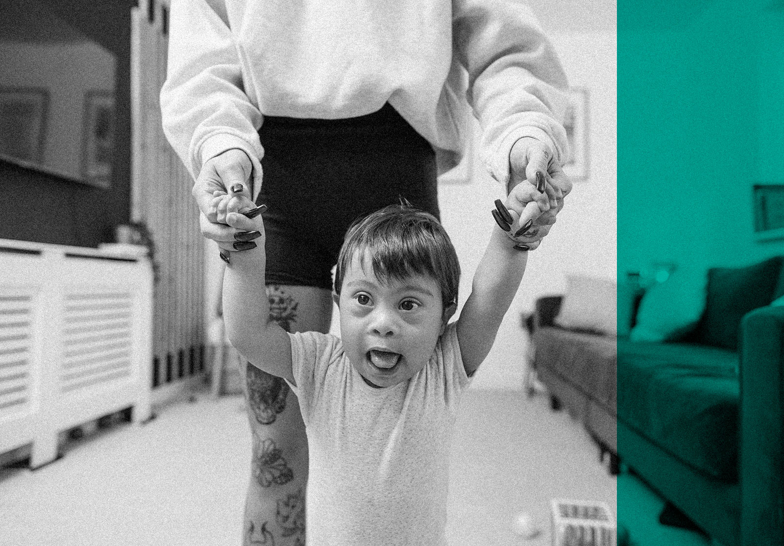 Toddler with down syndrome learning to walk supported by his mother