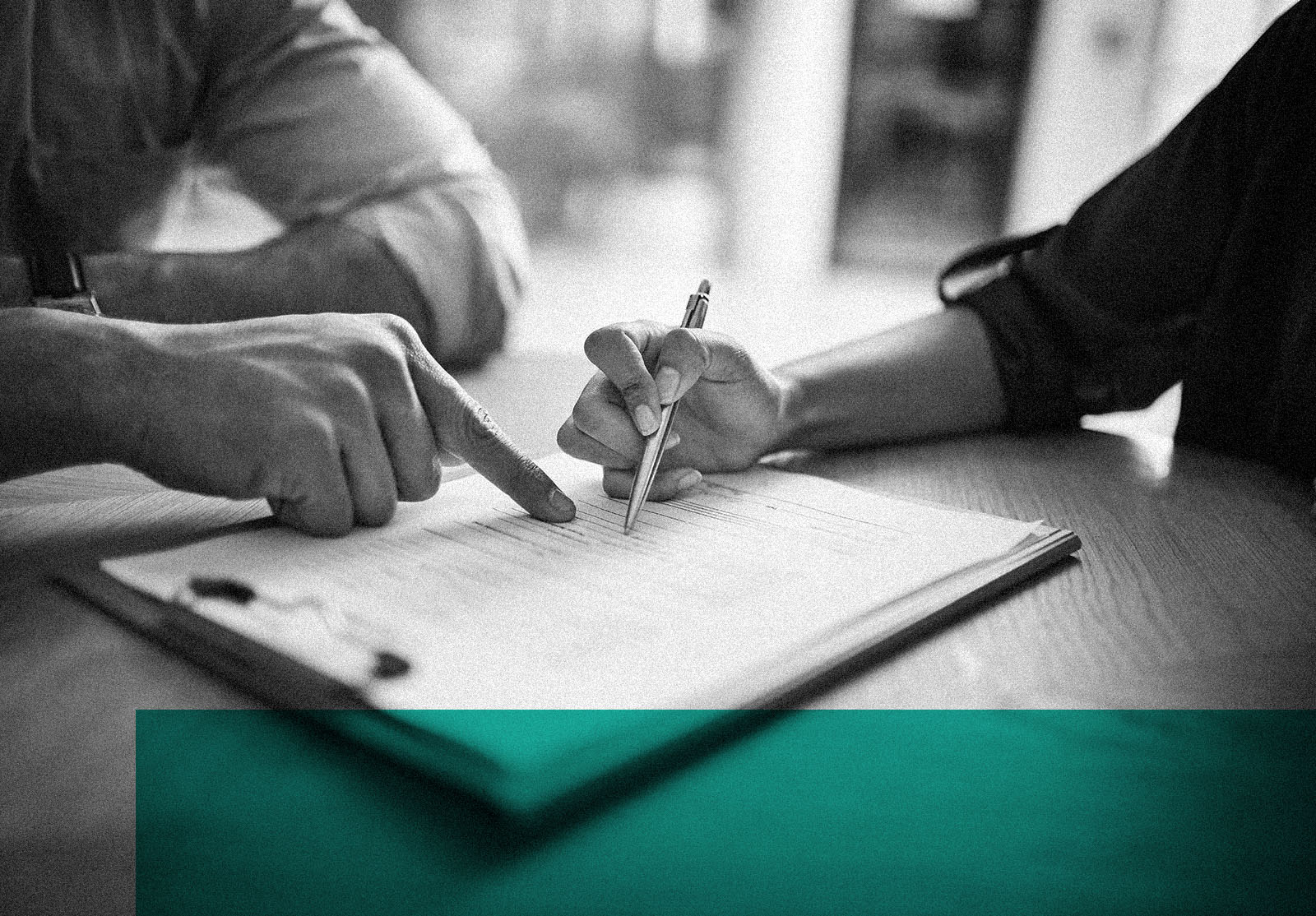 Person signing a contract agreement with client