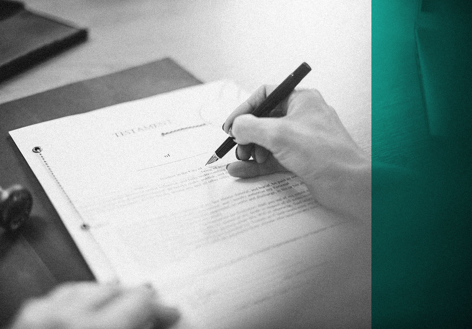 Lawyer working in the office on a Last Will and Testament.