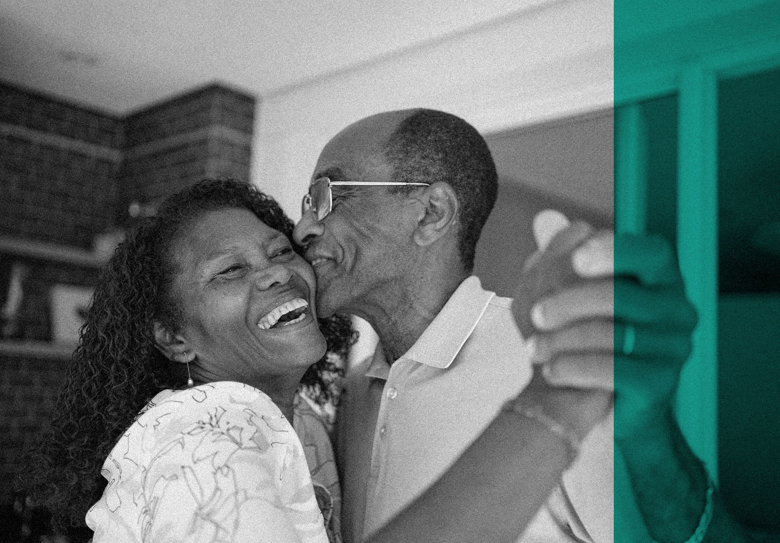 African American senior couple dancing on the balcony