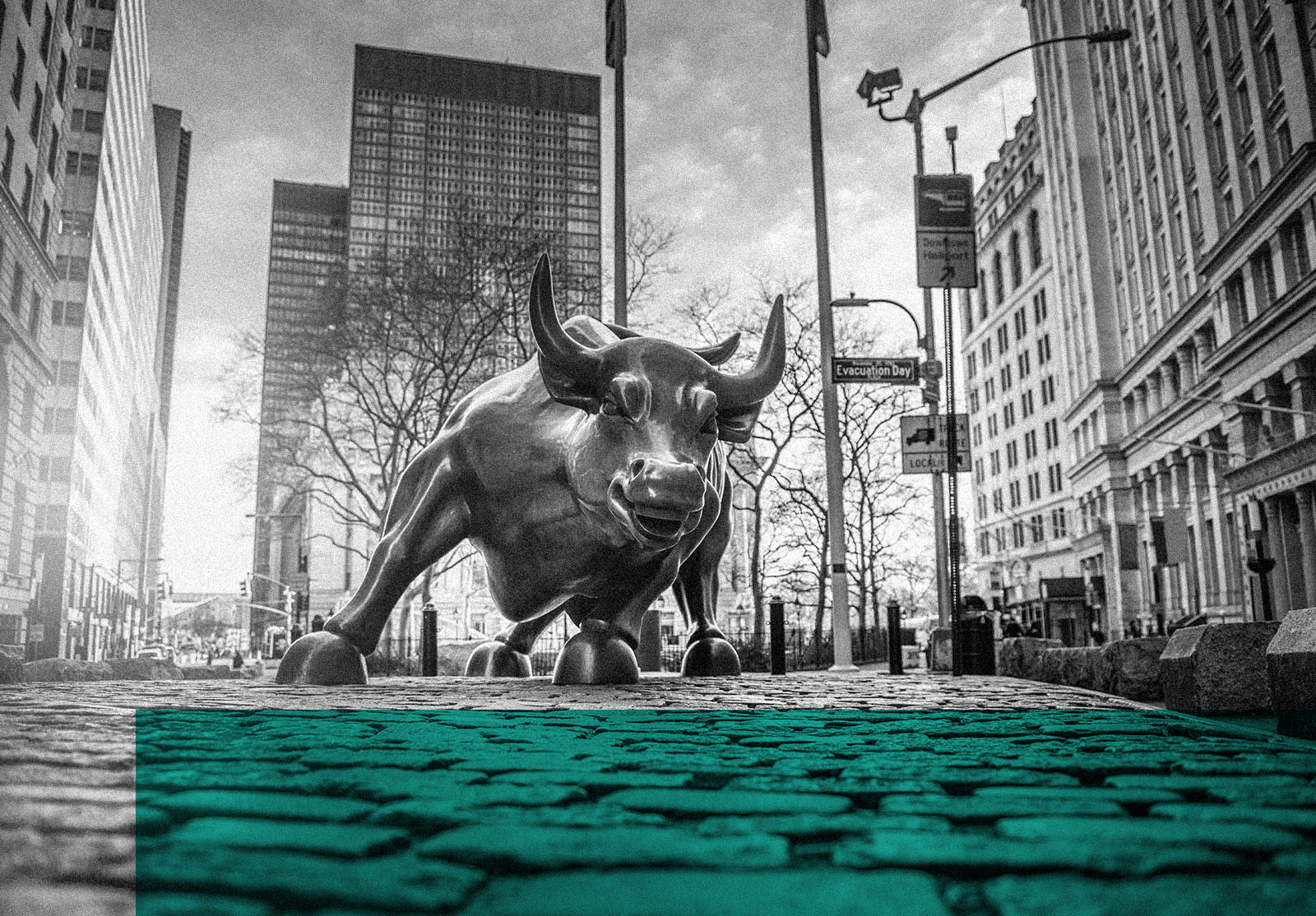 NEW YORK CITY - MARCH 24, 2020: Charging Bull sculpture on March 24, 2020 on empty streets of New York City during Corona virus Epidemic.