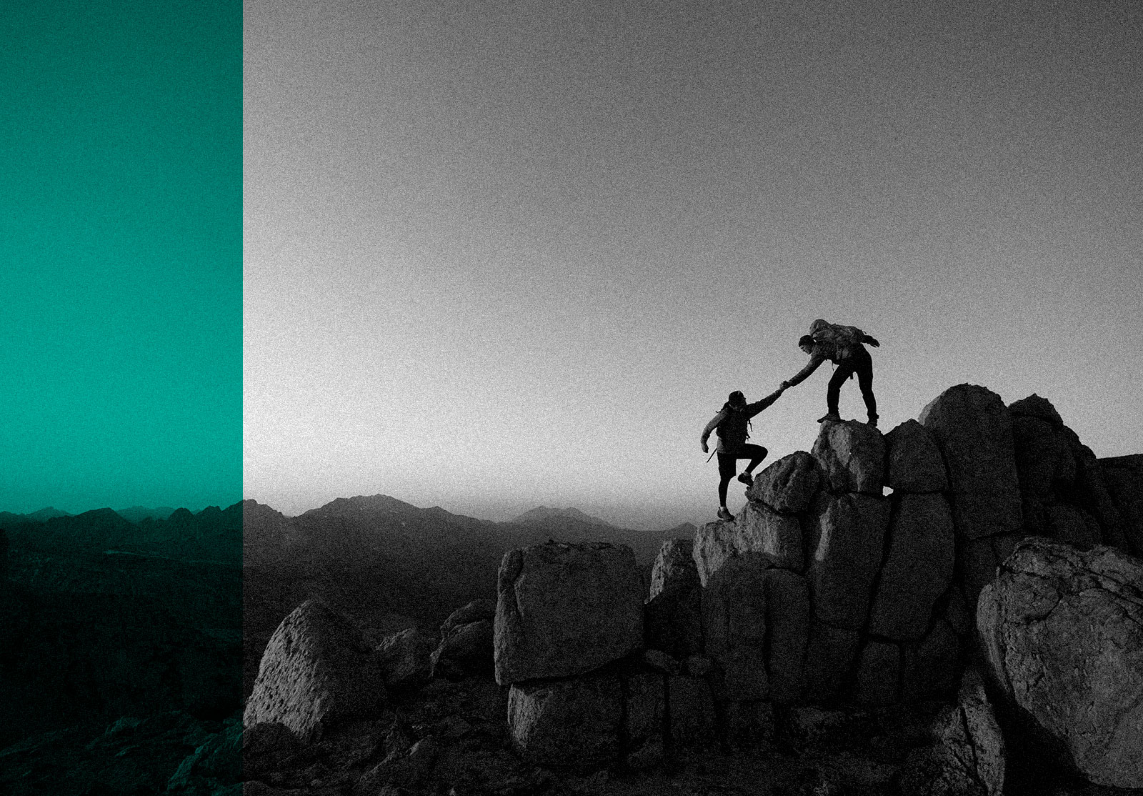 Two team members conquering challenging summit