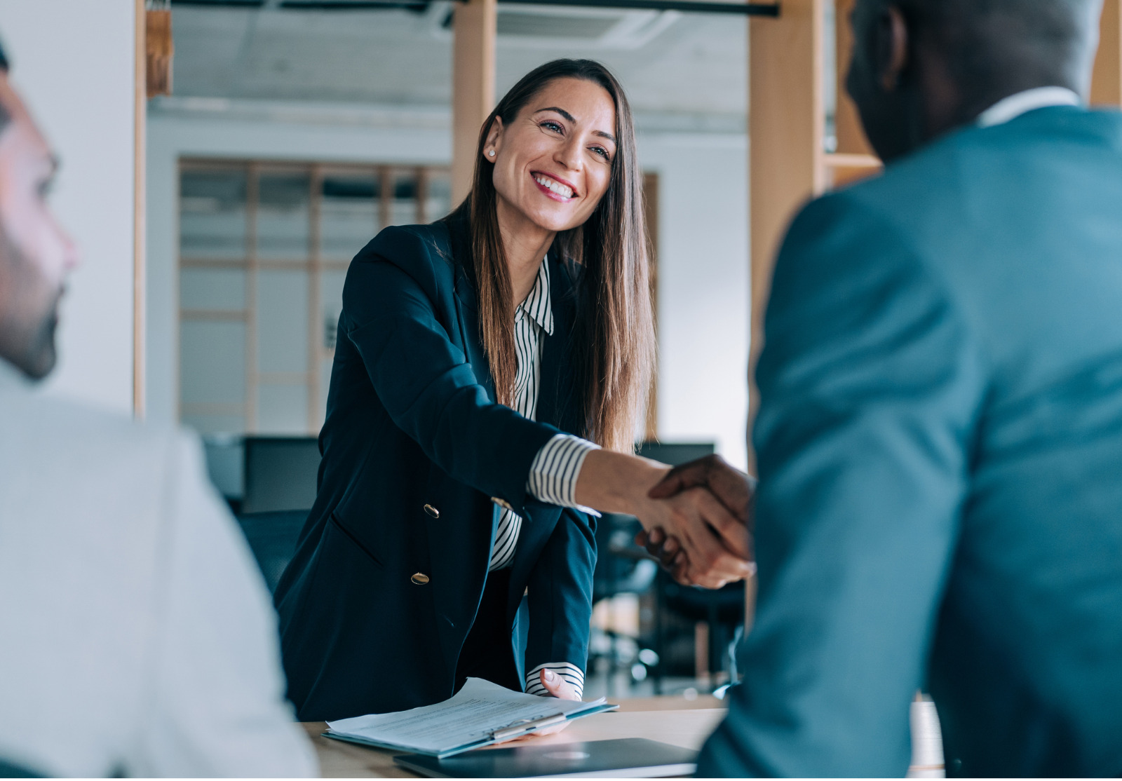 Business people shaking hands in the office.