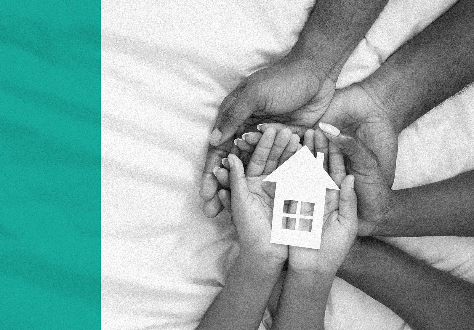 Family members hands holding cutout of house