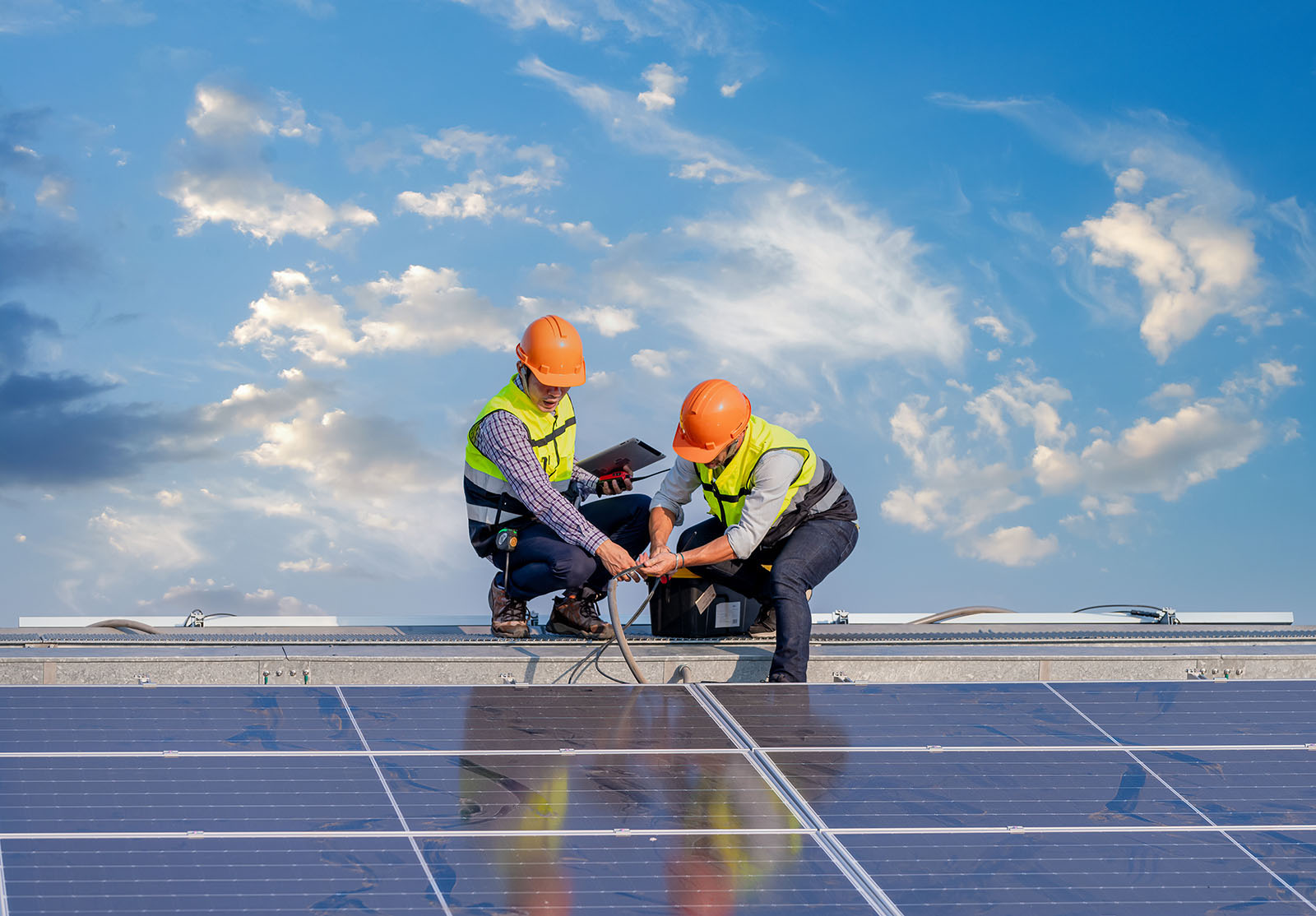 Solar panel, workers on roof