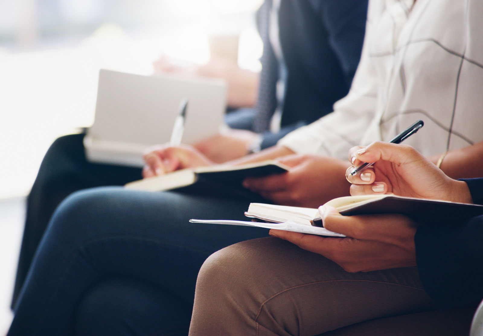 People learning, taking notes