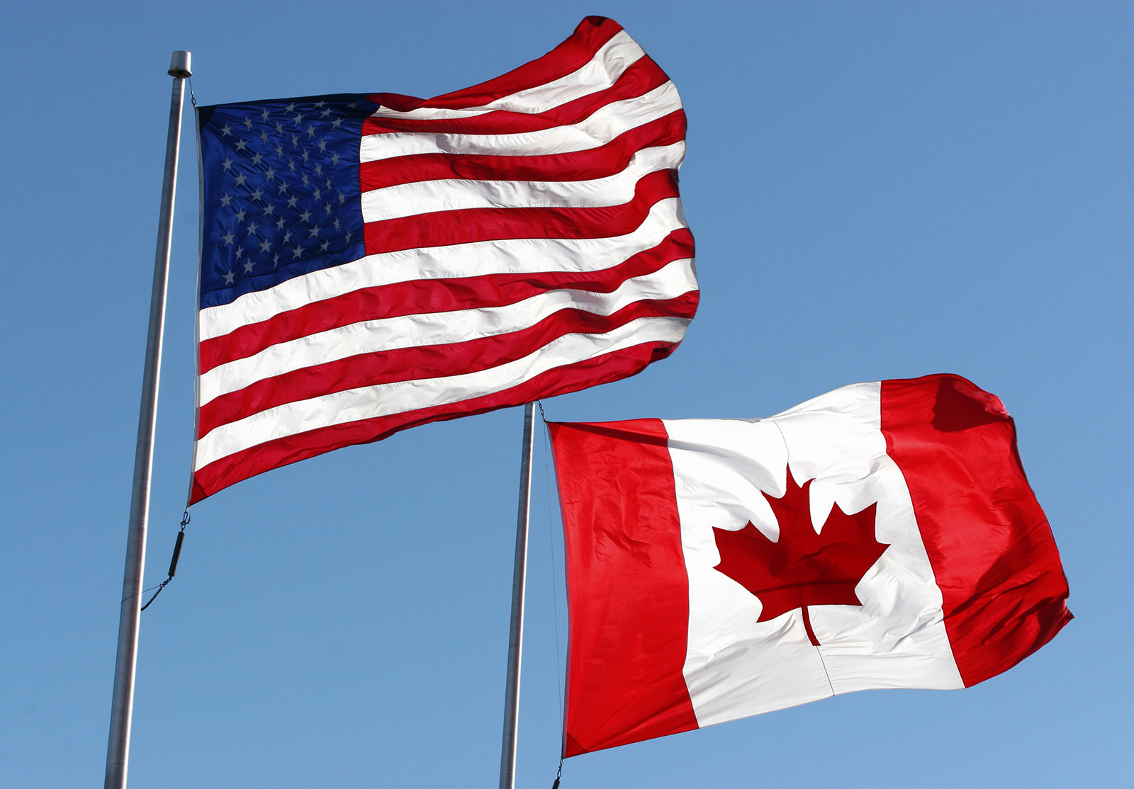 U.S. and Canadian flags flying; United States and Canada