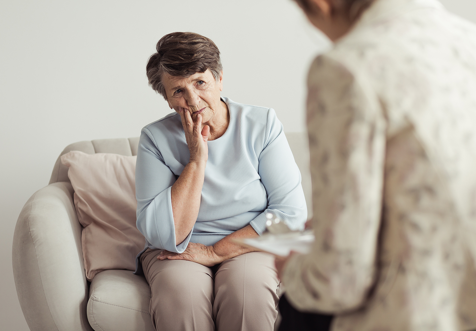 Sad senior woman during appointment
