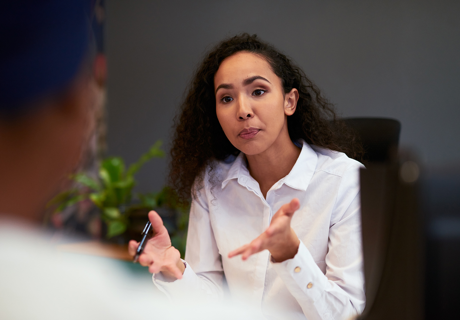 Bank, finance or debt counsellor talking, planning and working on strategy to help client with a loan payment plan. Female financial advisor giving advice or guidance in a serious credit consultation
