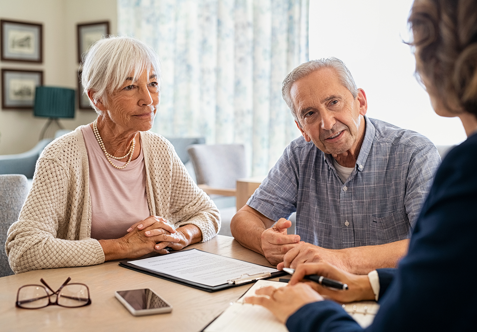 Senior couple planning their investments with financial advisor