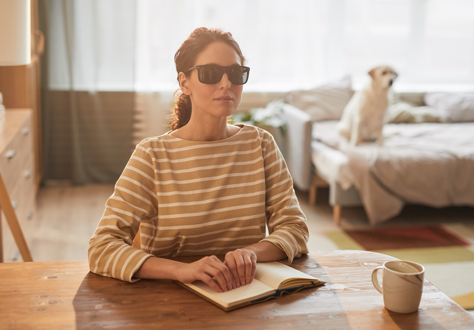 Blind Woman Reading Book at Home