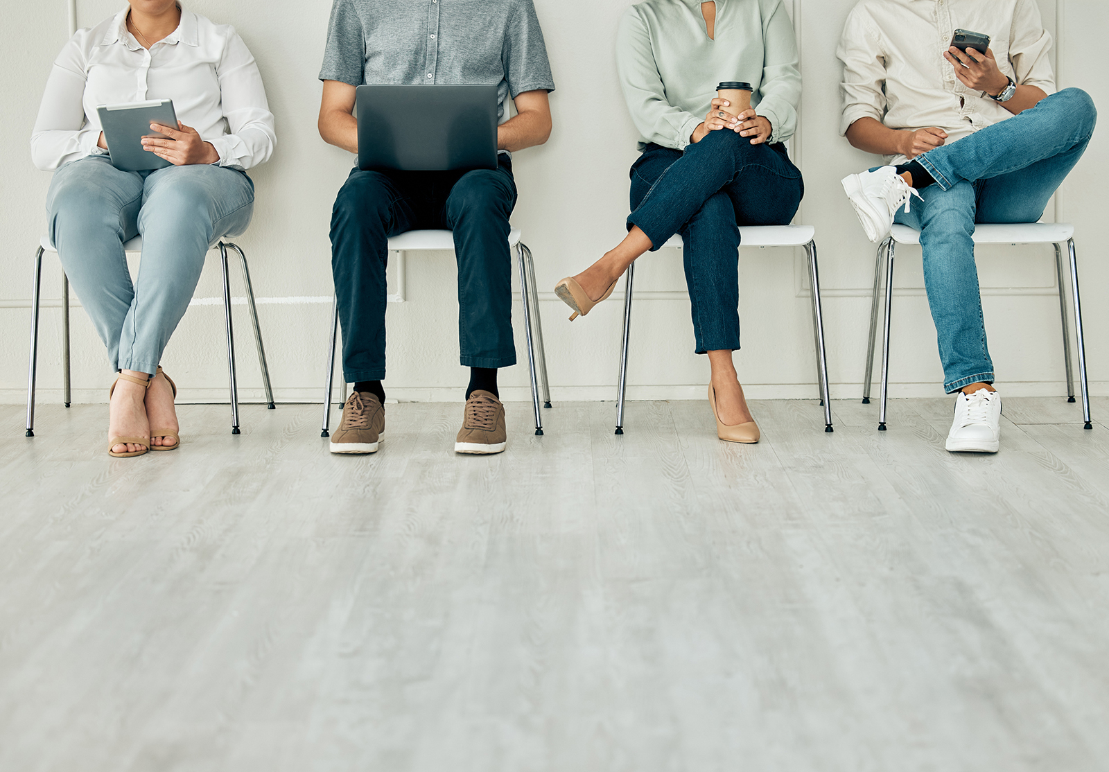 Recruitment, job and hiring interview with people waiting for hire team using technology. Potential business office digital tech workers ready for contact us agency meeting on a computer and phone