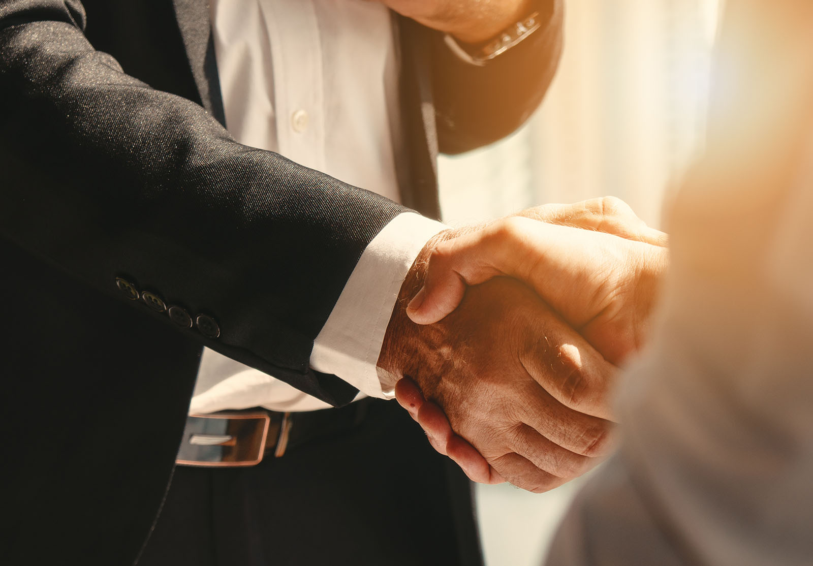 Business background of businessman having handshake