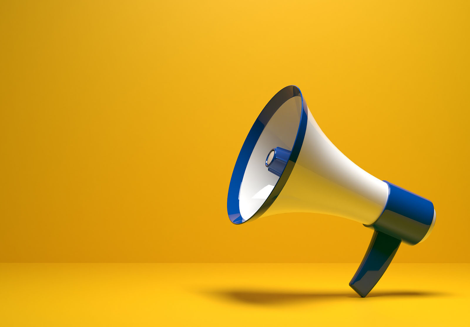 Blue white striped Megaphone instrument on yellow background with copy space.