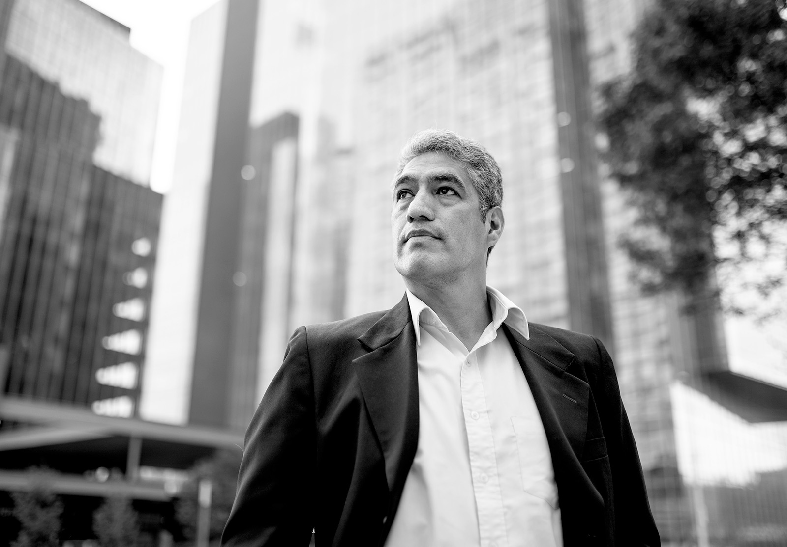 Low angle photo of businessman looking away